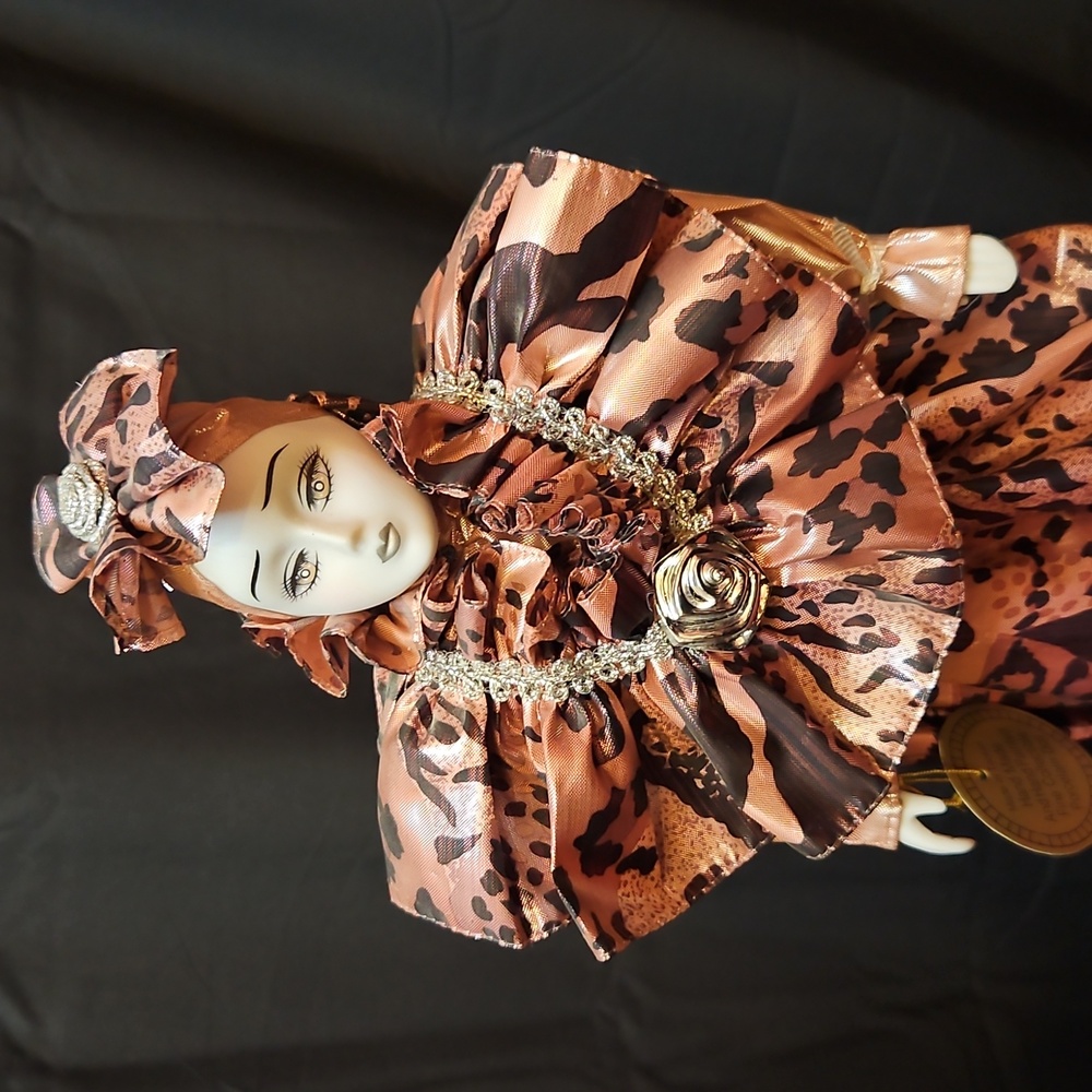 Elegant Porcelain Doll with Animal Print Dress